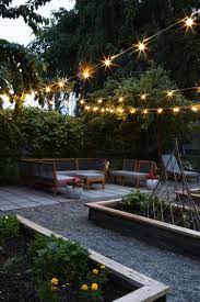 A Nighttime Garden Tour The Grit And Polish Backyard Lighting Diy Sloped Backyard Backyard Lighting