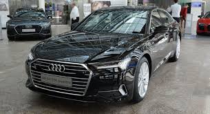 Audi A6 Vs Bmw 5 Series Vs Mercedes E Class 2016 2019 Audi A6 Shows Up At The Forum Wearing Mythos Black Metallic Carscoops Audi A6 Black Audi Audi