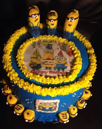 Vanilla cake with ice cream in the middle. Minion Cake Buttercream Frosting Handmade Minions And Edible Images Minion Cake Edible Images Buttercream Frosting