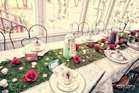 The alice in wonderland table was set on a pink tablecloth with matching napkins folded into the shape of a rose. Kara S Party Ideas Wonderland Birthday Party Kara S Party Ideas