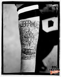 Crucifix or an ankh on back of Mr Cartoon Colour Tattoo Big Tattoo Planet