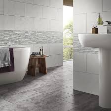 These tile effect kitchen or bathroom panels are guaranteed to create a room full of character and colour, with a hint of mediterranean pastime. Oscano Grey Mix Matt Splitface Stone Effect Ceramic Wall Tile Pack Of 6 L 300mm W 600mm Diy At B Q