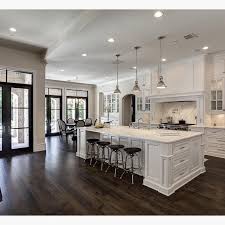 Whether you are young or a woman in her mid 40's and have graying hair you should know that gray hair color is very popular among women regardless of the age. Love The Contrast Of White And Dark Wood Floors By Simmons Estate Homes House Home White Kitchen Design
