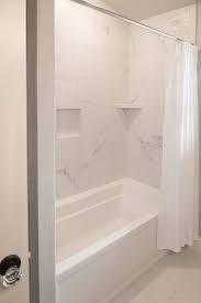 Tiles 12x24 tile in a small bathroom 12x24 bathroom tile layout. Bath Surround And Flooring Tile Mayfair 12x24 Statuario Veneto Grout Frost Bathroom Remodel Shower Shower Remodel Tile Tub Surround