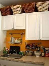 30 Clever Ways To Decorating Kitchen Cabinet Storage Above Kitchen Cabinets Decorating Above Kitchen Cabinets Kitchen Cabinets Decor