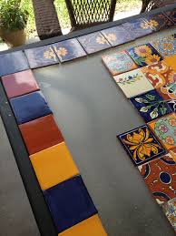 I Was Tired Of Looking At Our Yucky Patio Table And Couldn T Find The One I Wanted In Stores I Decided To Re Mexican Tile Table Tile Patio Table Mexican Tile