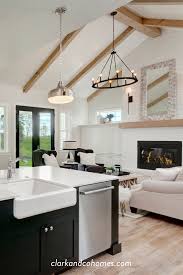 Blue, white, and gold accents. The Creek Pointe Farmhouse Vaulted Ceiling Living Room Beams Living Room Ceiling Beams Living Room