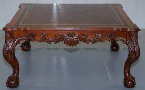 The post on too adds 3. Lovely Hand Carved Brown Leather Top Mahogany Coffee Table With Claw And Ball Feet At 1stdibs