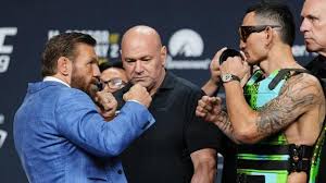 McGregor flings Holloway's sunglasses during intense stare-down