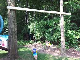 Use this guide to learn how to make a tree tie secure knots in each end of the rope so the swing hangs about two feet off the ground. Chad S Workshop Swing Between 2 Trees Swing Set Diy Playground Design Playground Landscaping