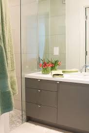Contemporary Bathroom Features A Full Height Mirror Lined With A Faucet Over A Gray Modern Trendy Bathroom Tiles Trendy Bathroom Designs Modern Bathroom Vanity