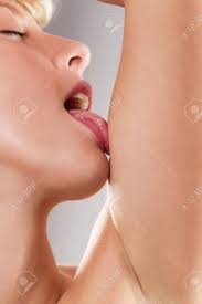 Sexy Gorgeous Sensual Woman Licking Her Arm Stock Photo, Picture and  Royalty Free Image. Image 23736013.
