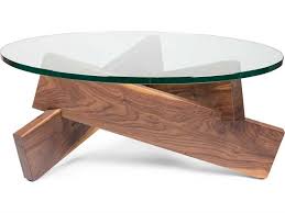 Either way the table's surface can be used for snack bowls and drinking glasses on movie night, or for more decorative purposes. Ion Design Plank Walnut 36 Round Coffee Table With Glass Top In 2021 Coffee Table Colorful Coffee Table Glass Top Coffee Table