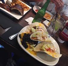 Serve with shredded white cabbage, hot sauce, sour cream, red onion, green onion, and cilantro. Delicious Fish Tacos Succulent Ribs In Barbecue Sauce And A Double Burger Picture Of Corona Beach House Miami Tripadvisor