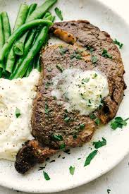 Place the steaks onto the grill plate. Perfect Air Fryer Steak With Garlic Herb Butter The Recipe Critic