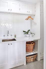 The subway tiles add a unique accent. Laundry Room Ideas White Laundry Room Design Laundry Inspiration Design White Laundry Rooms Laundry Room Design Laundry Room Decor