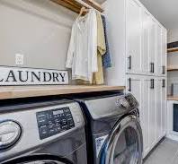 Storage-Conscious White Shaker Laundry Room With Warm Touches