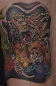 12 Japanese Lion Tattoo Designs And Ideas Petpress Japanese Lion Tattoo Lion Tattoo Japanese Lion Tattoo Design