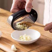 Kitchen Garlic Press at ₹ 62/piece | Kitchen Tools in New Delhi | ID:  26015147255