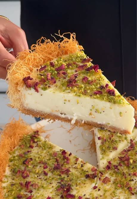 Kataifi nests on a platter with pistachios and rose petals