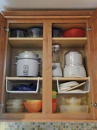 13 Clever Ways To Get Your Tupperware Collection Under Control Tupperware Organizing Kitchen Cabinet Organization Cupboards Organization