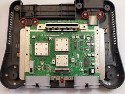On nintendo 64, the shape of the back part of cartridge and the shape of inside game slot is different. Nintendo 64 Repair Ifixit