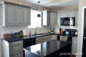 Black kitchen cabinets are a less complex color palette, instead opting for monochrome style with splashes of grey to. Gray Kitchen Cabinets With Black Counter Google Search Kitchen Cabinets With Black Appliances Grey Kitchen Cabinets Grey Cabinets