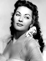 Yvonne DeCarlo was certainly one heck of a beauty. Love her gorgeous green  eyes. I think she should have been cast in better films, because she was  really good. I really loved