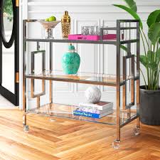Crafted with an open metal frame, this piece showcases three tiers that give ample space for tableware and wine set. Gold Flamingo Aidan Serving Bar Cart Reviews Wayfair