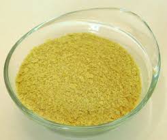 Nutritional yeast is a flakey, yellow powder that is a perfect vegan substitute to achieve that cheesy taste. Nutritional Yeast Wikipedia
