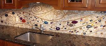 Kitchen with granite slab backsplash that contrasts slightly with the style of the main countertops. How Kitchen Mosaics Can Breathe Life Into Your Cooking Space