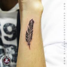 To achieve these washes of color that sit behind the bold lines of the actual dream catcher, it appears that the artist first free handed the water color influenced smears of pink and purple. 97 Cute Coolest Feather Tattoos Designs Media Democracy