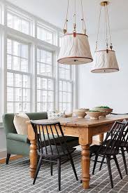 The table and chairs are made from solid birch, mango, and rubberwood in a cream finish for a country cottage aesthetic. Forest Green Roll Arm Settee At Farmhouse Dining Table Cottage Dining Room