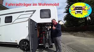 Natürlich kann eine schutzhülle als garage nicht im gleichen maß alle kriterien wie eine feststehende garage erfüllen, aber sie eignet sich hervorragend für verschiedengroße und unterschiedlich gebaute wohnmobile. Fahrradtragersystem Fur Die Heckgarage Im Wohnmobil 11 Youtube