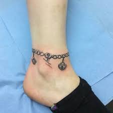 Pin By Missy Cetnar On Ankle Tattoos Charm Bracelet Tattoo Anklet Tattoos Charm Anklet Tattoo