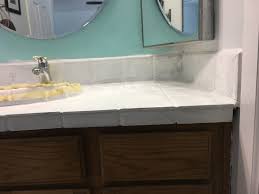 Using a brush, edge a coat of extreme bond primer to all exposed areas of the bathroom vanity. Before And After Bathroom Vanity Transformation With Painted Tile Countertop The Minimal Ish Mama