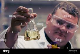 ICM technical director Scott Kohl holds food grade corn oil at the  company's research lab in Colwich, Kan., Monday, June 9, 2008. Researchers  at ICM have also learned how to extract a