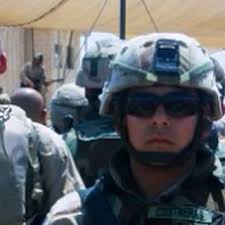 See the guy way in back playing the guitar? That's Toby Keith who played  for our troops in Iraq when my husband was serving. (That's Mark in the  pic). This is what