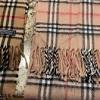 Using 30 different steps, the scarf is woven on traditional looms. 1