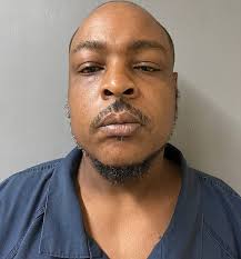 Folding chair man' seen wielding furniture during viral Alabama riverfront  brawl turns himself in to cops a week after huge scuffle with white boaters  enraged after being asked to move out of