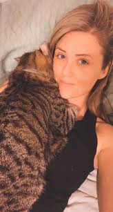 Sweet little cat hanging around William Street. Gray and white young  female.