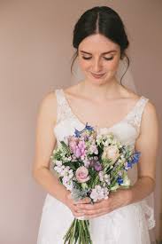 This bride paired her sunflowers with bright roses and gerbera daisies, and we love how her bouquet and floral crown by kittelberger florist tied together for her soiree at her family's property. Homespun Jewish Summer Wedding In Nottingham By Grace Elizabeth Photography Boho Weddings For The Boho Luxe Bride