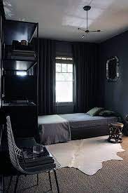 Through a quirky painted door is another relaxing space that also doubles as a bedroom. Cool Room Designs For Men