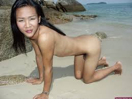 Very sexy petite ladyboy offering her mouth watering naked body on a  tropical beach