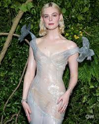 To some, arriving at an important event naked is the stuff of nightmares.  For others, its a meticulously planned reality. For Elle Fanning, who  showed up to Monday nights Met Gala in