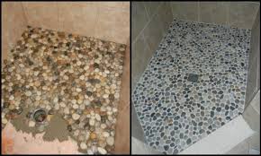 Installation of river rocks on shower floor one by one, by www.houstontileworks.com. Create Your Own Pebble Shower Floor Your Projects Obn