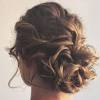 Up next in long curly hair bun styles: 3
