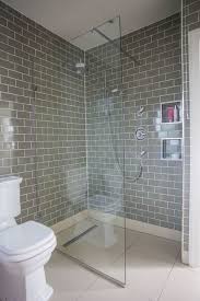 Blue subway tile contrast with 1×1 white tile. Bathroom Makeover Grey Brick Tiles And Pink Accessories Makes This A Relaxing Haven