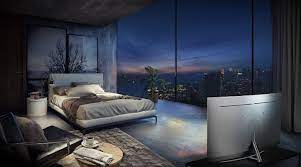 There Is A Bedroom Overlooking The City View In The Early Evening With The Glow Of The Setting Sun The Bed Is Interior Design Inspiration Home Luxury Interior