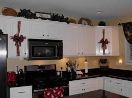 More Changes To My Kitchen Kitchen Cabinets Decor Kitchen Cabinets Christmas Kitchen